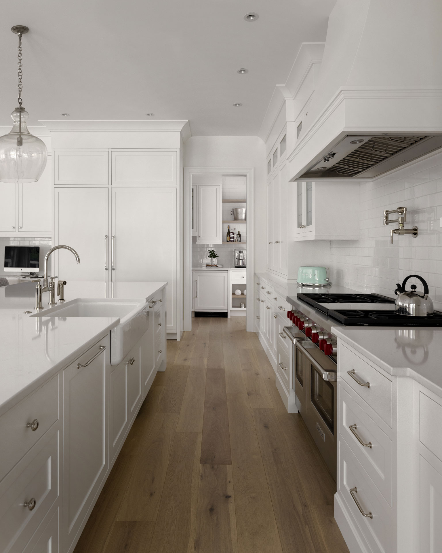 Photo of modern white kitchen with wood flooring