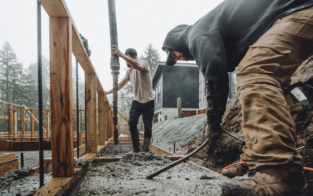 a couple guys laying rebar